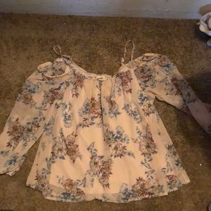 A cute off the shoulder shirt with sleeves